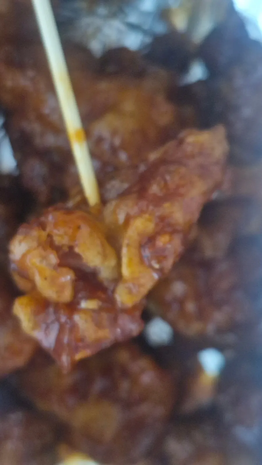 A piece of mild dakgangjeong eaten at home