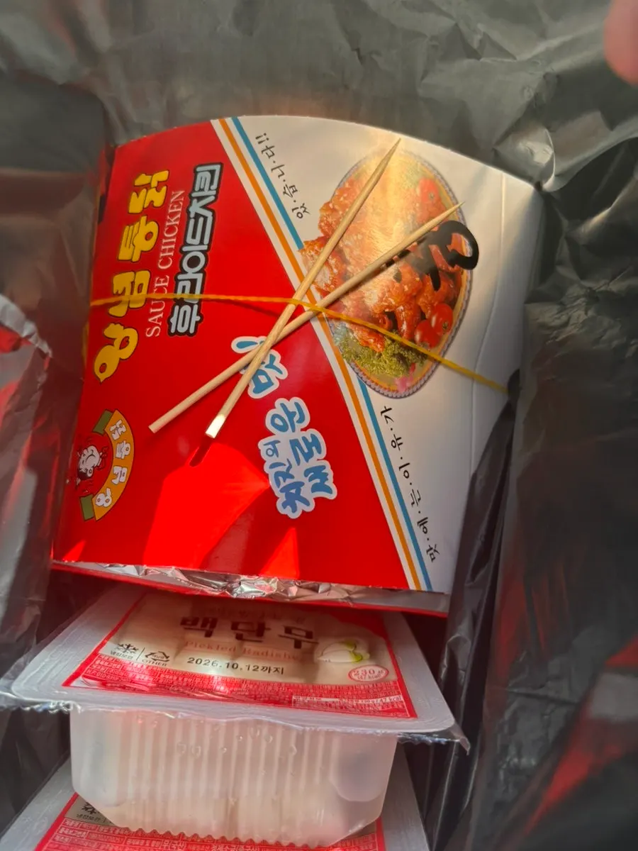 Dakgangjeong packed tightly into a takeout container
