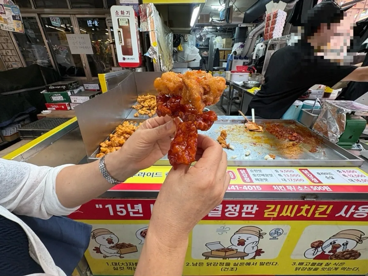 Dakgangjeong and old-school whole chicken being packaged for takeout