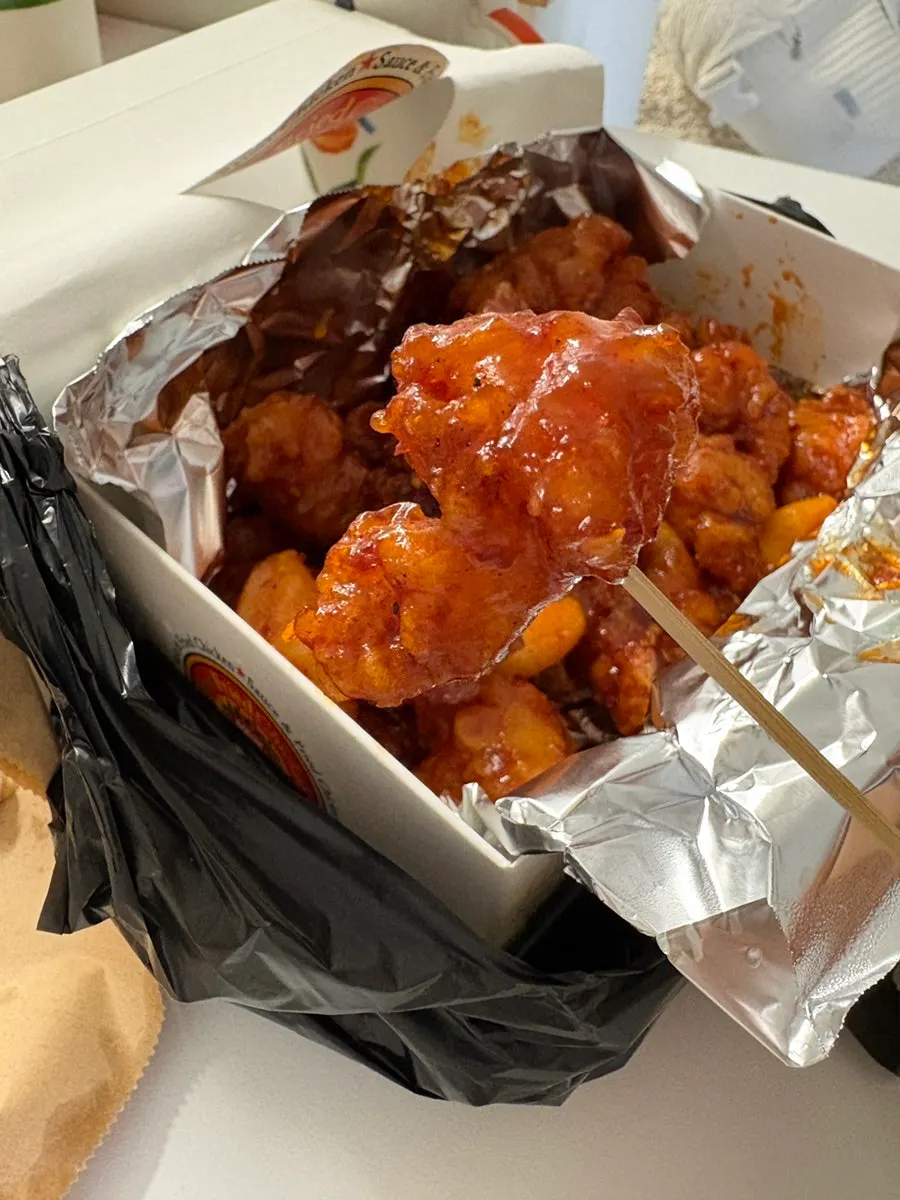 Old-school whole fried chicken brought home for takeout