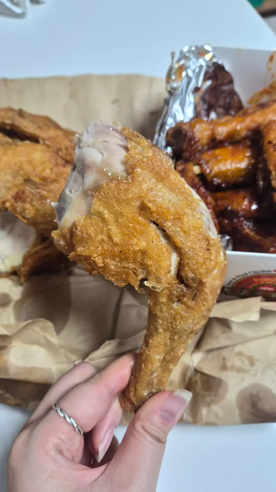 A piece of fried chicken with tender meat inside