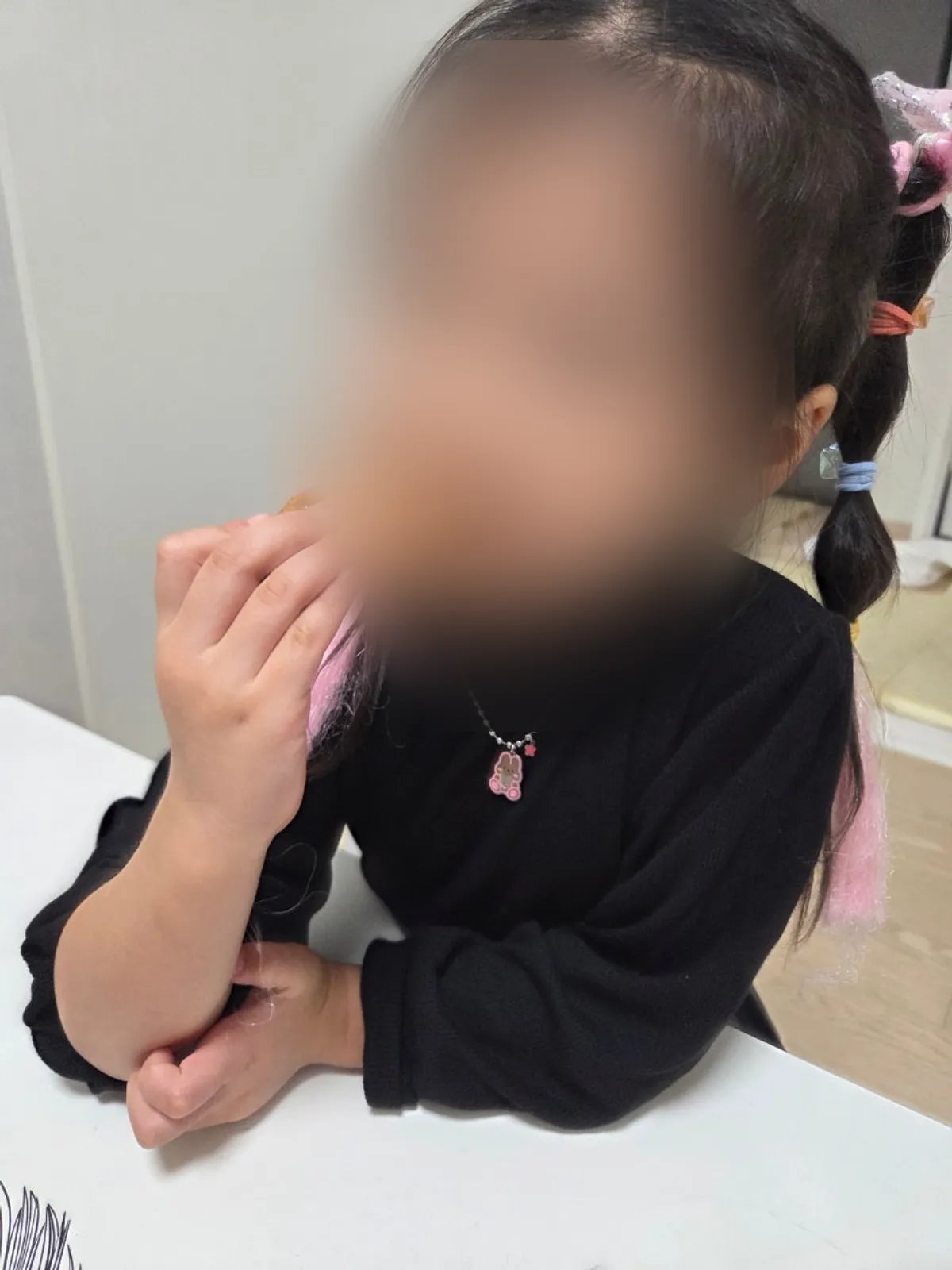 A child eating one of the wings