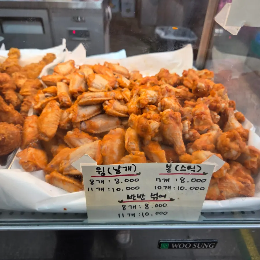 Store sign showing old-school fried chicken prices