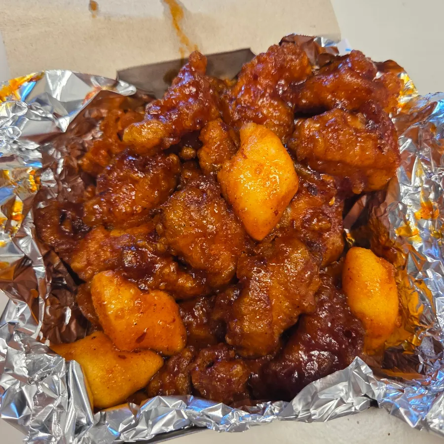 Two medium boxes packed full of dakgangjeong