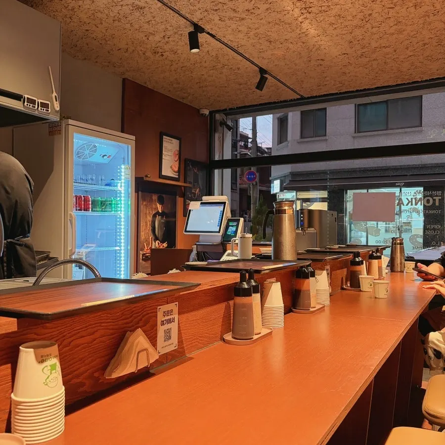 Wood-toned counter seating at Tonka