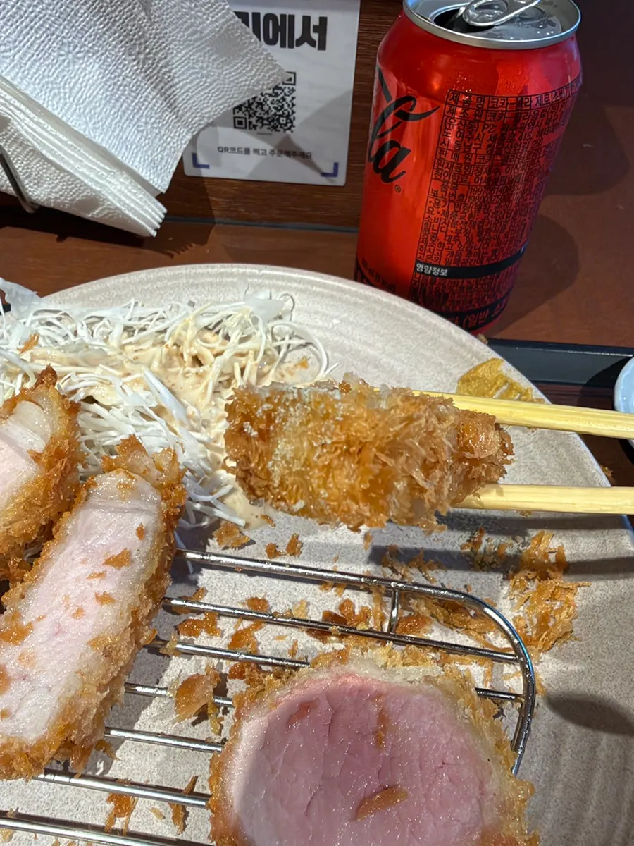 A piece of tonkatsu topped with mustard