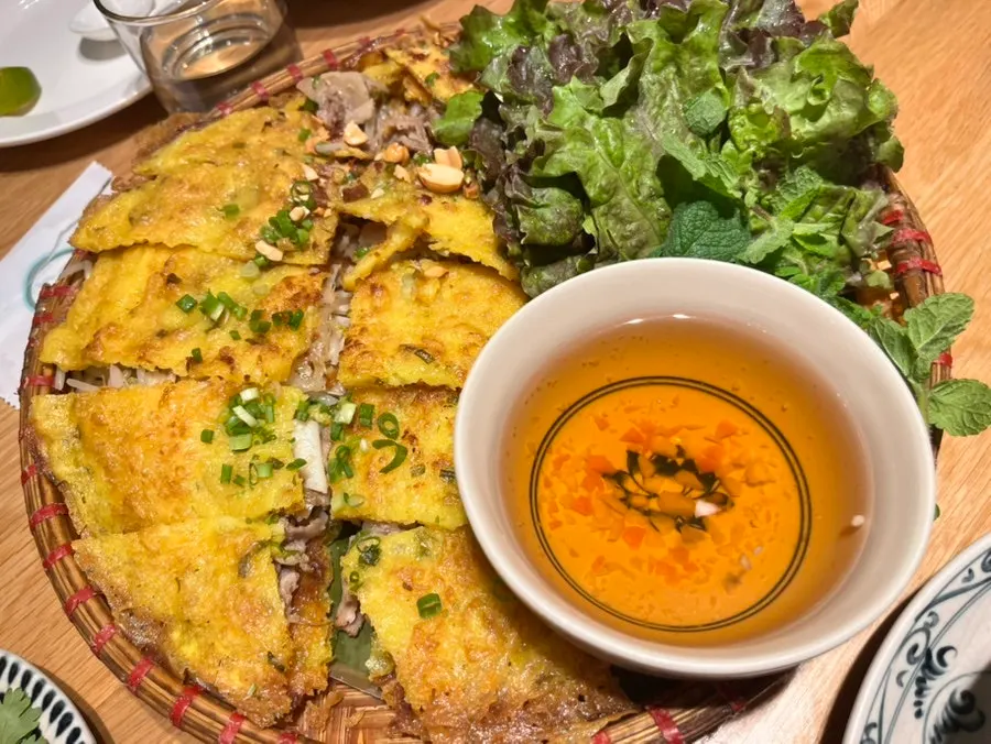 A separate plate of cilantro served with lime