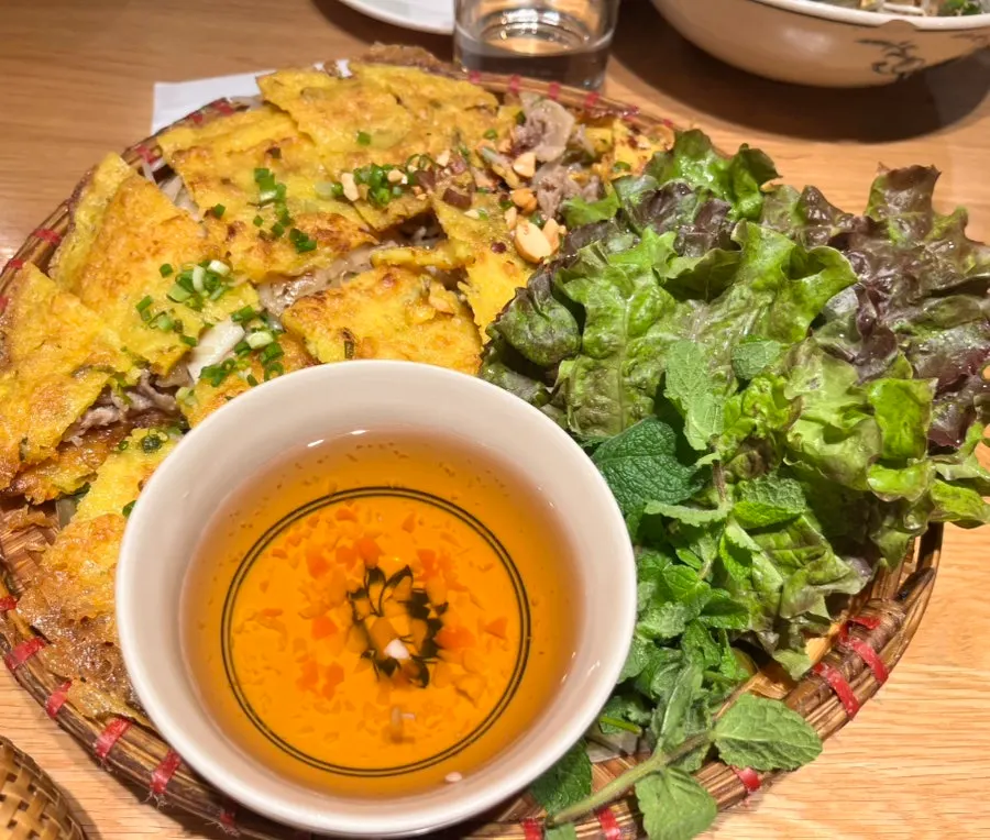 A large, freshly grilled banh xeo