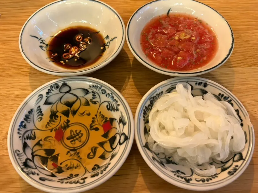 Soy sauce, salsa sauce, hoisin, and pickled onions — the basic sauces