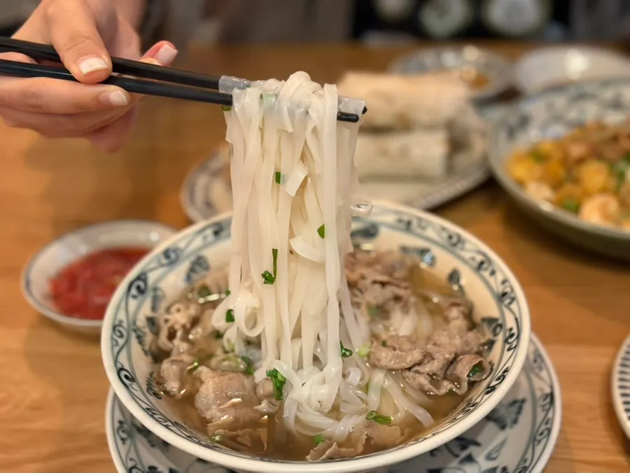 Close-up of pho topped with chadol-style beef