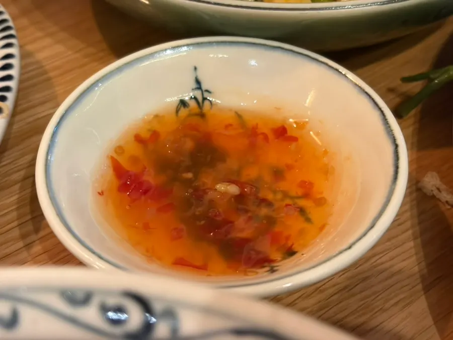A spoonful of fluffy seafood fried rice