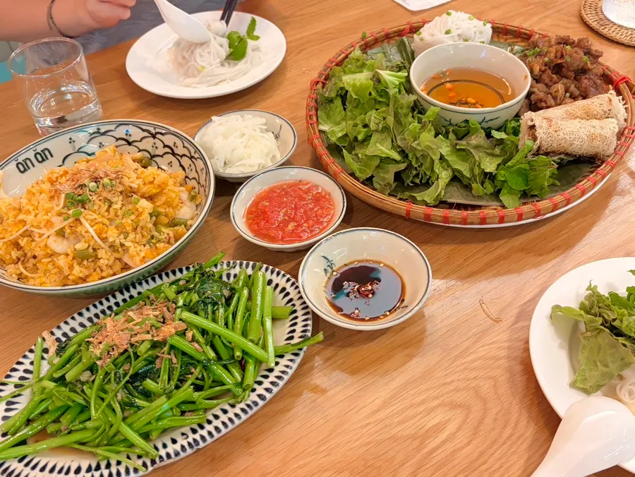 Vietnamese dishes ordered at Anan Gangnam Direct Store laid out on the table