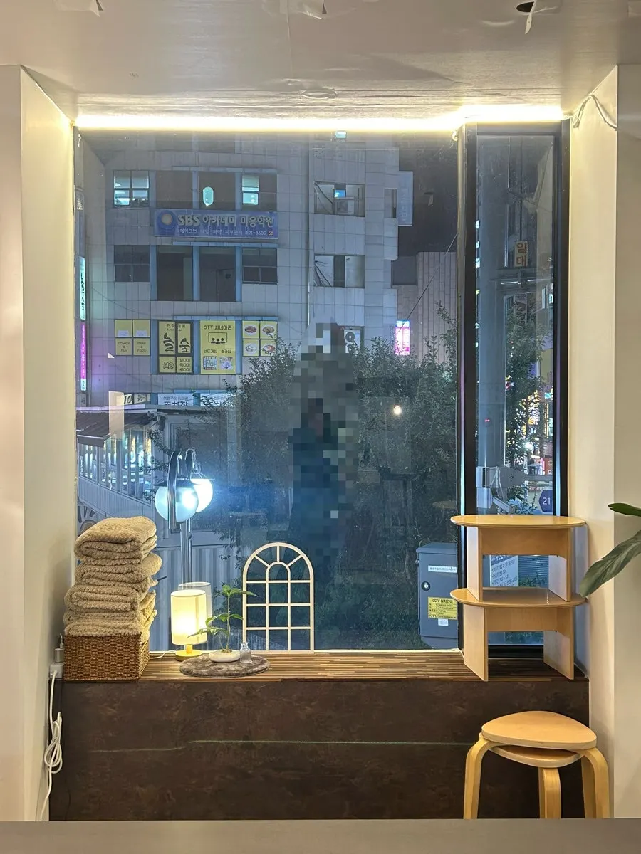 Floor-to-ceiling window seat with a bright view outside