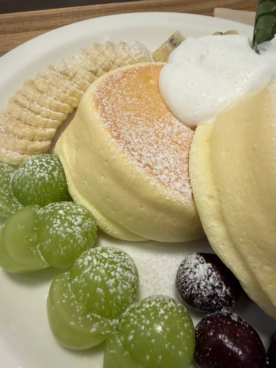 Andamiro Soufflé topped with seasonal fruit and whipped cream