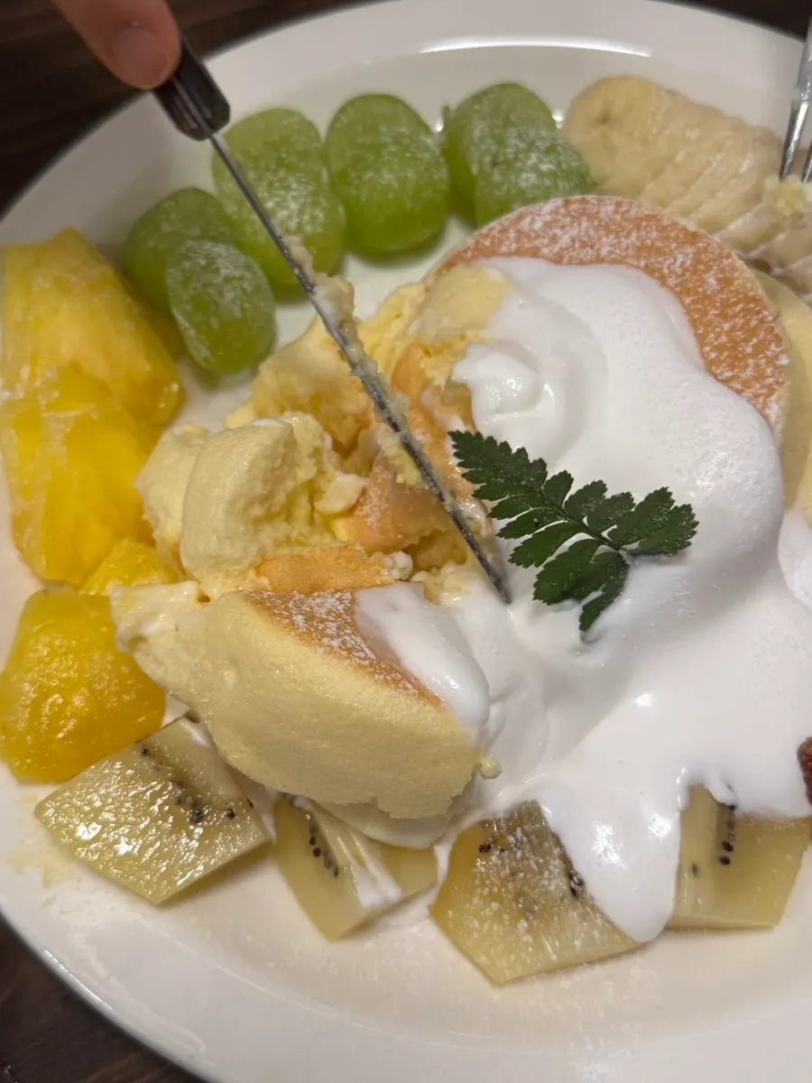 A fork cutting into the Andamiro Soufflé