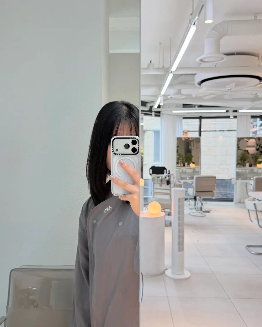 Before photo of dark-toned mid-length hair before color treatment