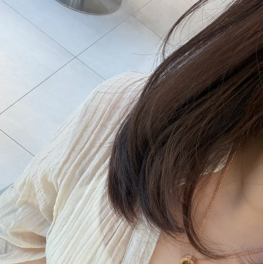 Ash brown hair that suits the skin tone