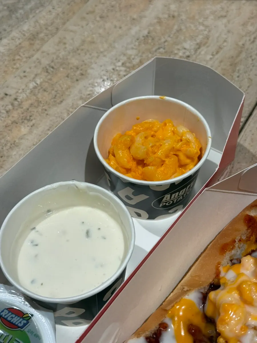 25cm Big Crunch hot dog topped with spicy chicken and mac and cheese