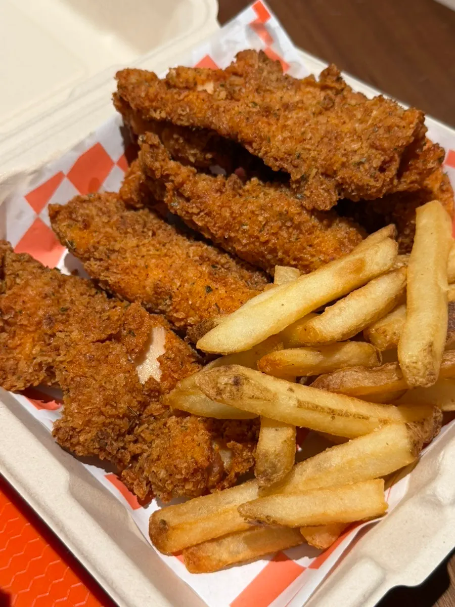 A full spread of the Deep Crunch Chicken Box, cheese sticks and pulled pork fries