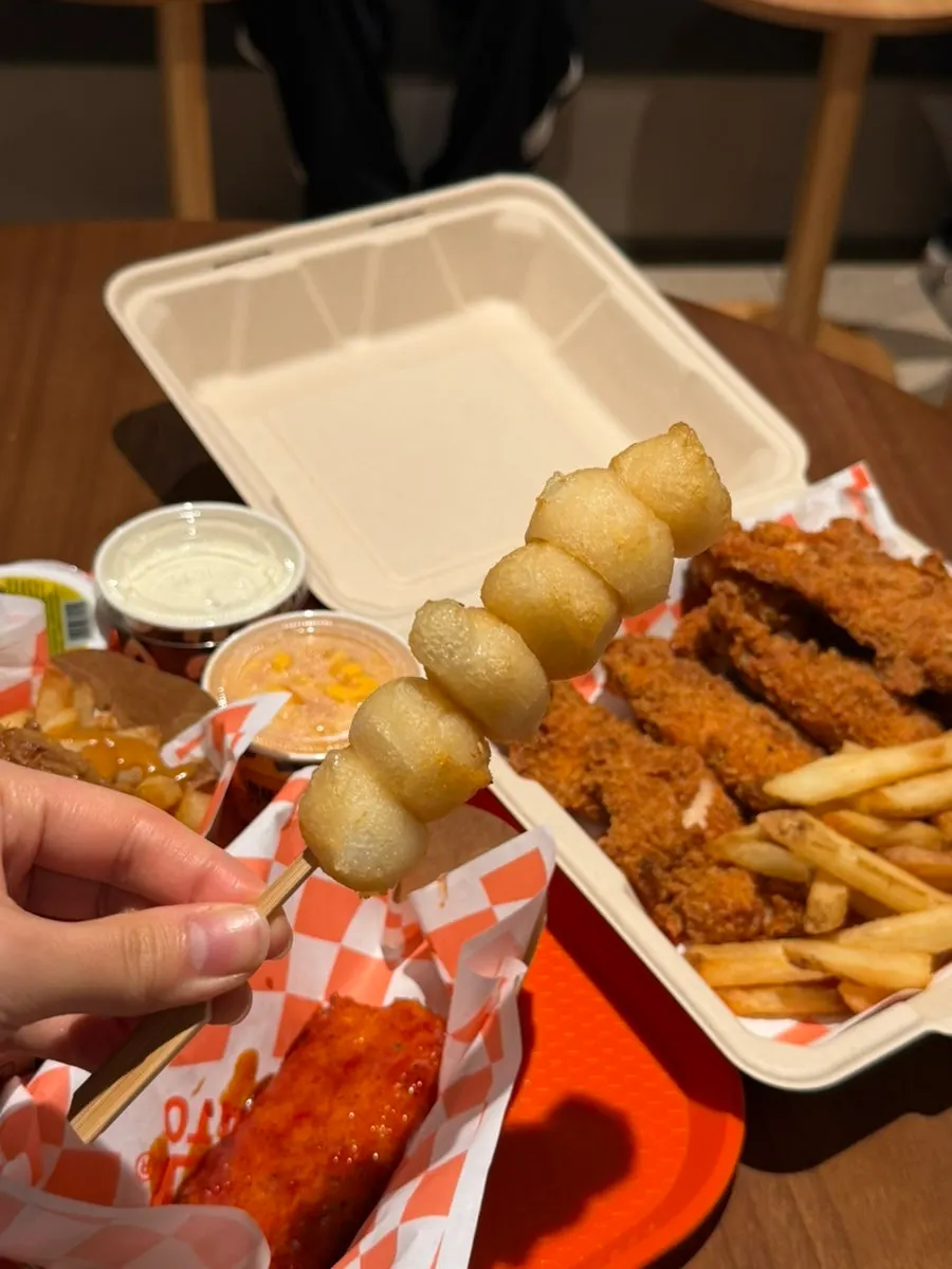 Four ordered items laid out on a food hall table