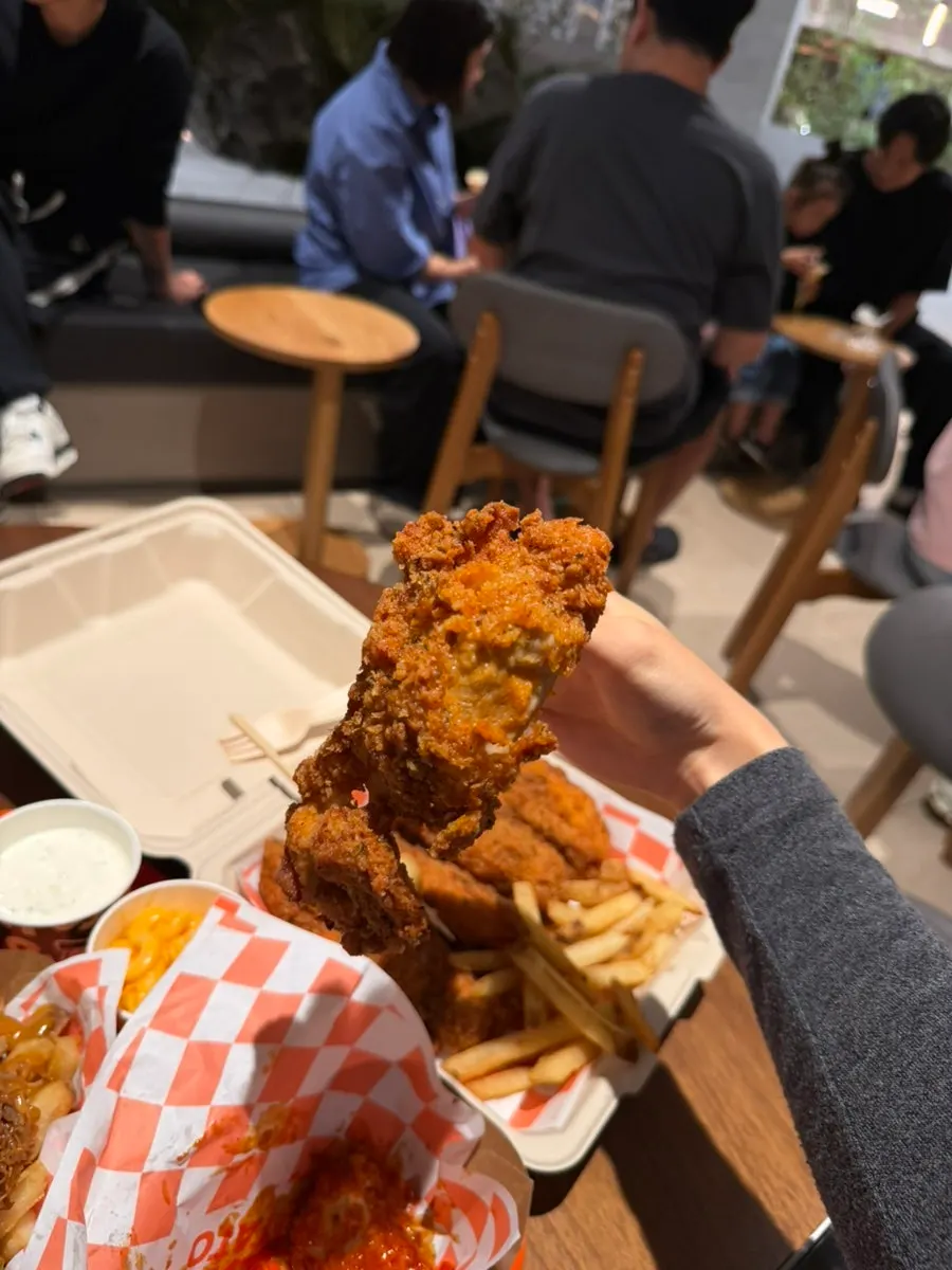 A bite of chewy potato dipped in ketchup