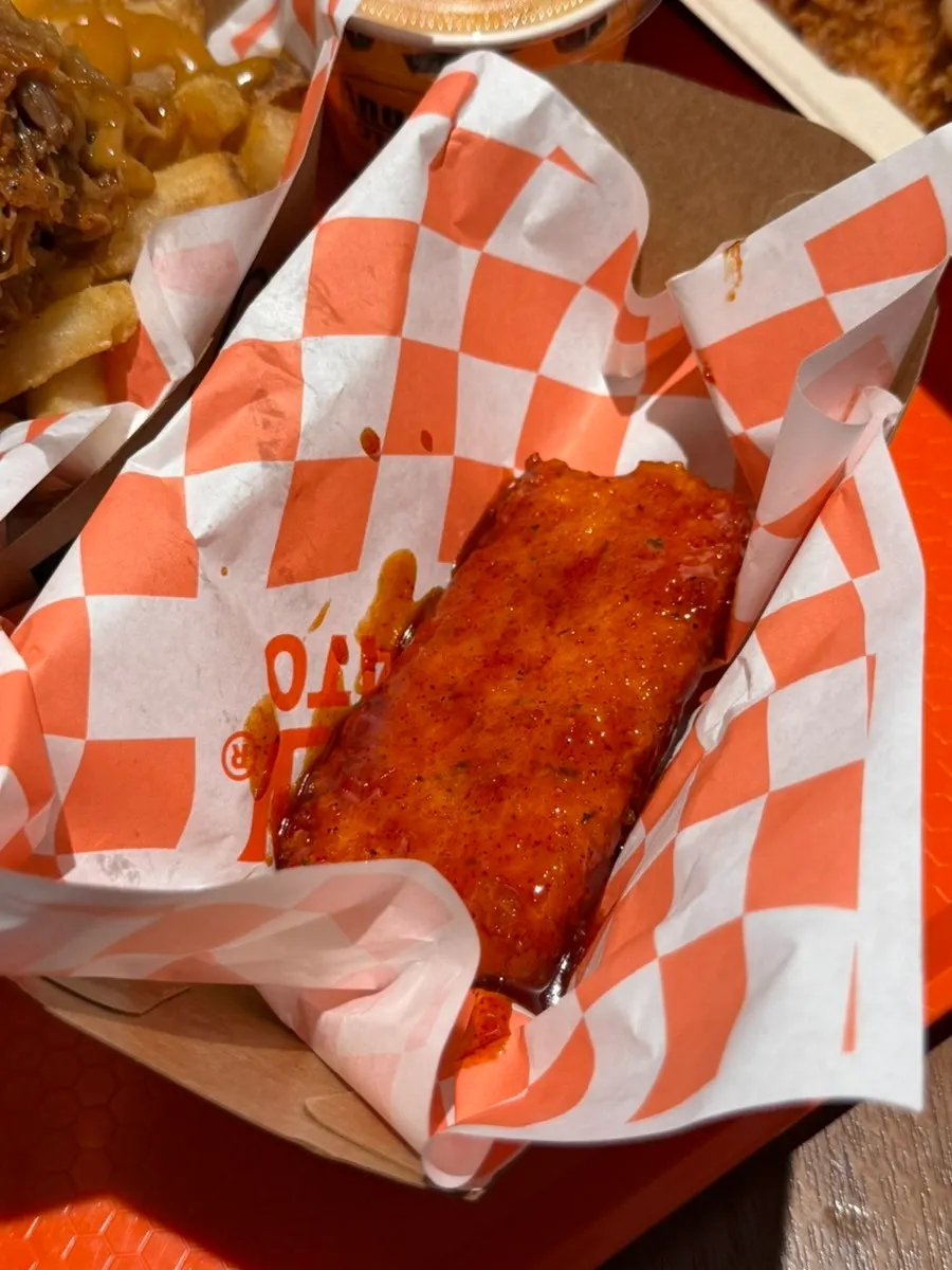 Hot crispy boneless chicken pulling apart tenderly