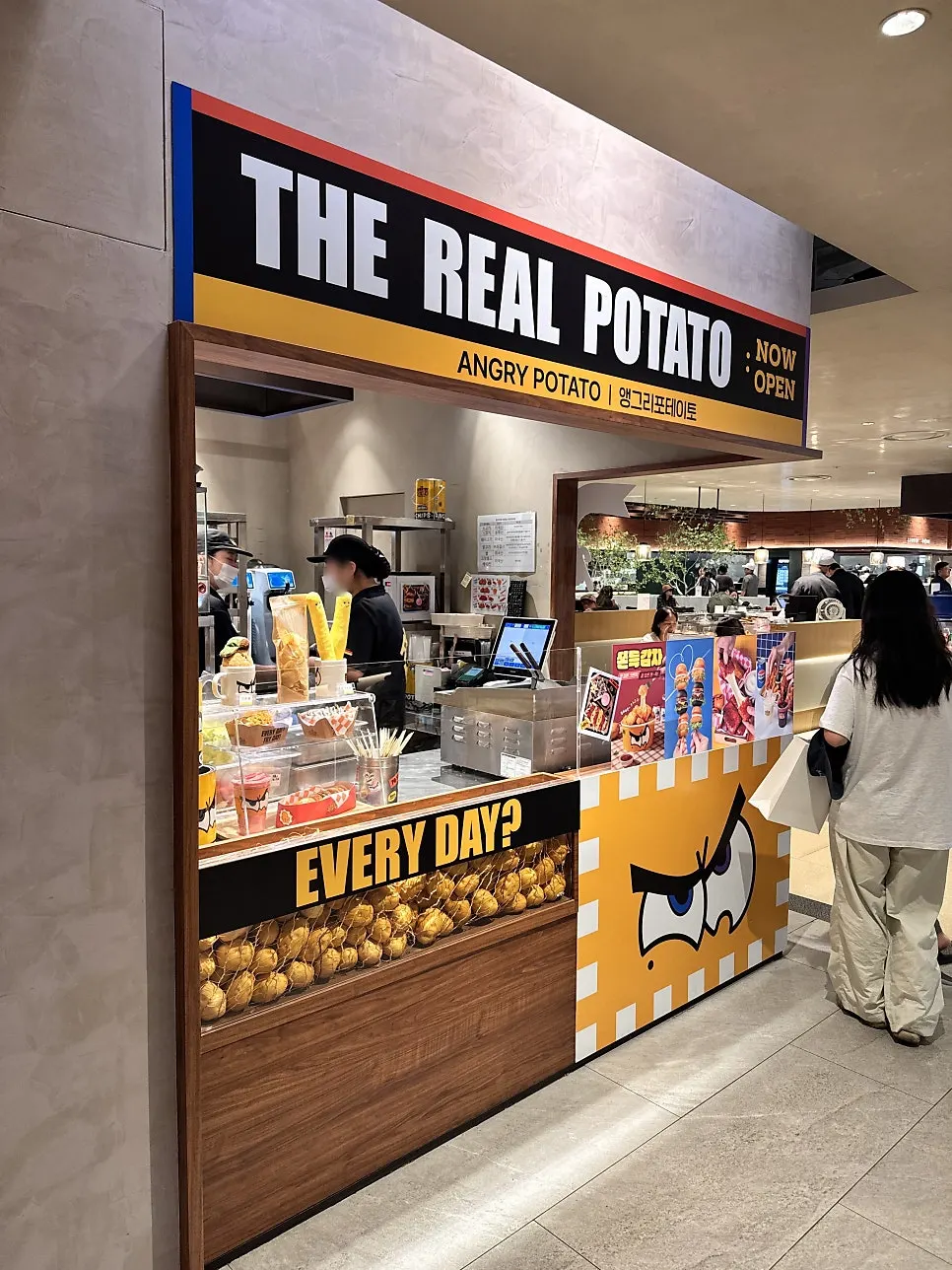 Angry Potato store interior and menu signage