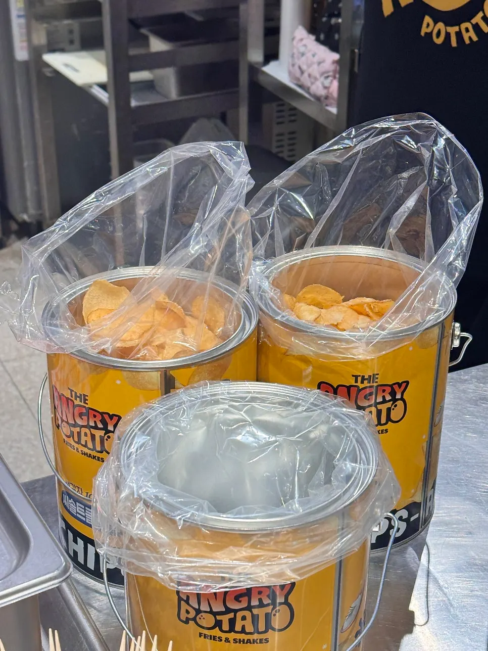 Angry Potato potato chip tin can featuring the character