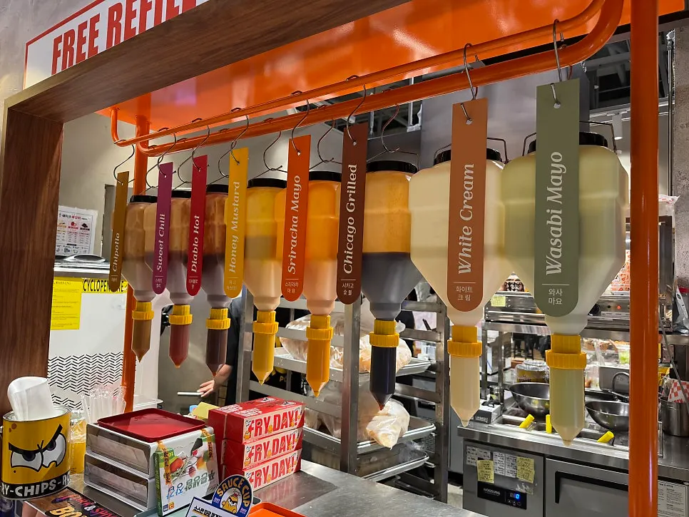 Cups of chipotle, cream white, and other sauces