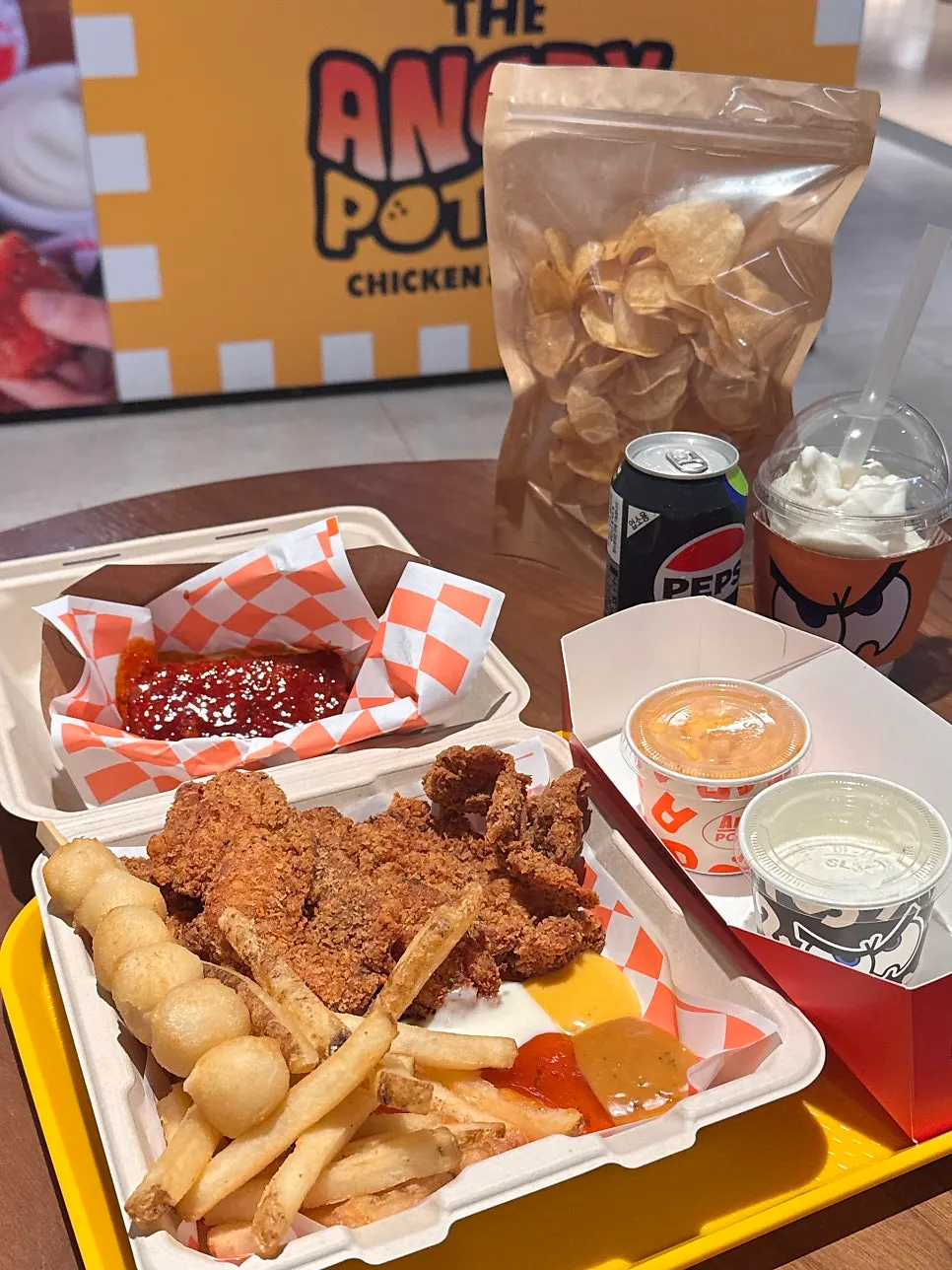Table with Chili's Cheese Sticks, potato chips, and ice cream