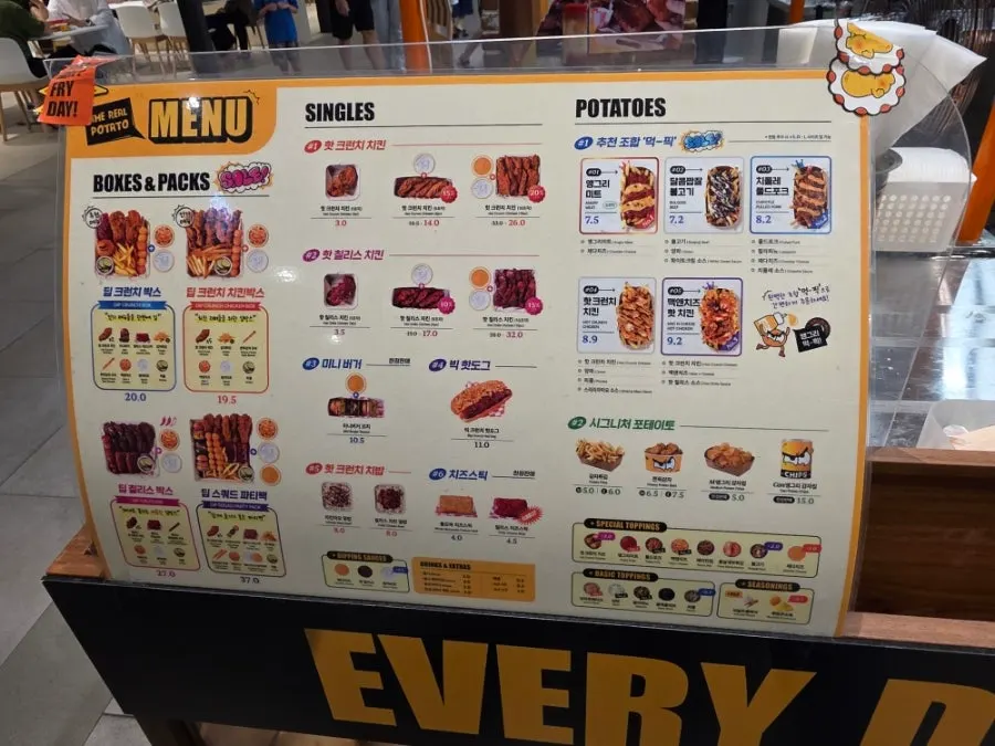Menu board with single items and sets at Angry Potato Songdo