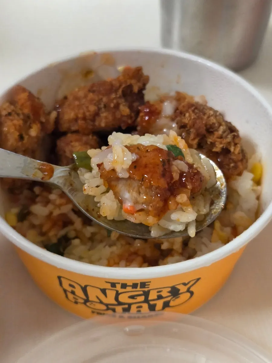 Crispy chicken rice bowl topped with spicy-sweet sauce