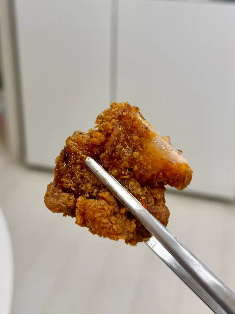 Cross-section of hot crunchy chicken with sauce