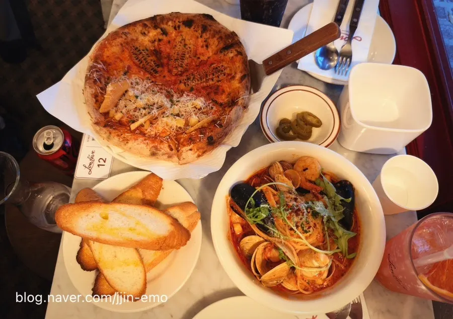 Food arriving one by one at the Low Five Anguk table