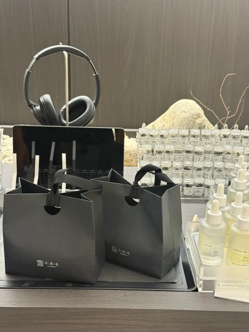 Two bottles of perfume made together by a couple
