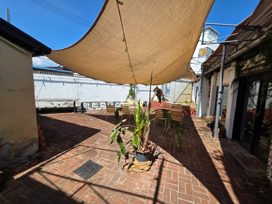 Outdoor courtyard terrace with a large canopy