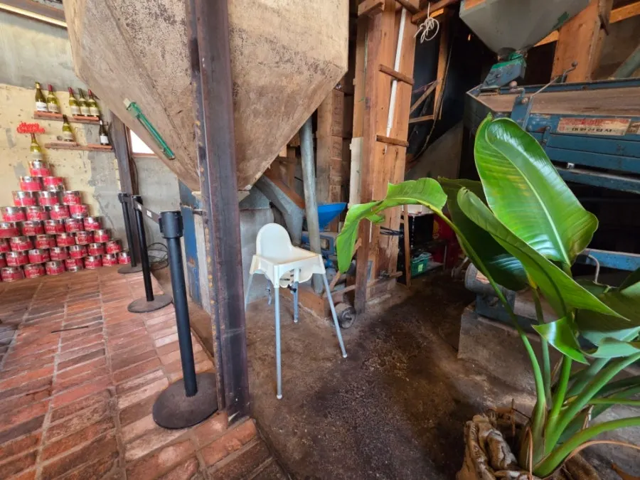 The 100-year-old rice-milling machine at the center of the interior