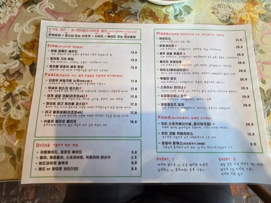 Menu board listing pasta dishes and set menus