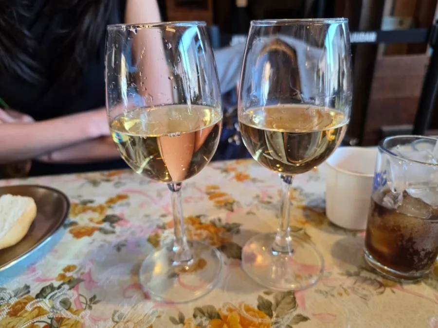 White wine served alongside the pasta