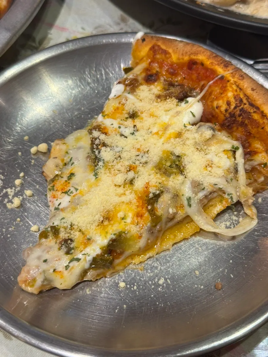 Spicy pizza slice topped with jalapeños