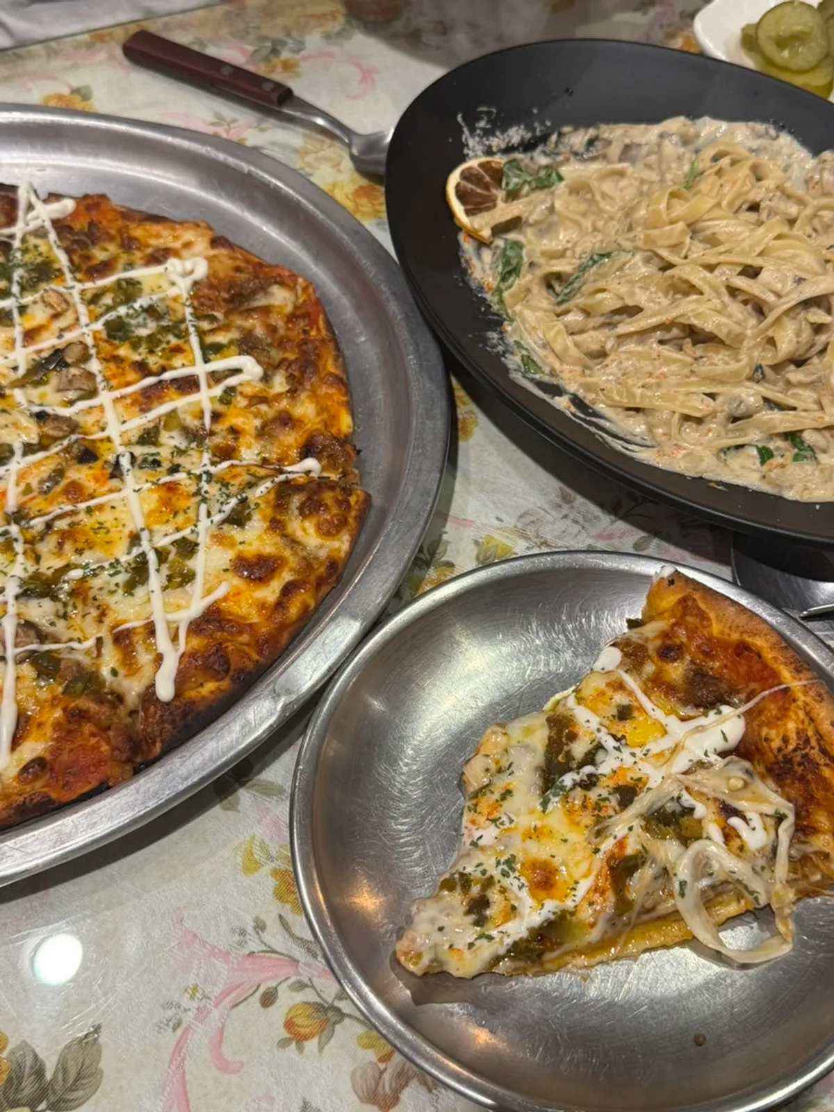 Lasagna pizza sprinkled with parmesan cheese