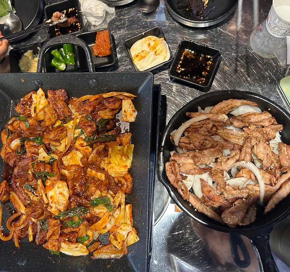 A bite of gopchang wrapped in lettuce