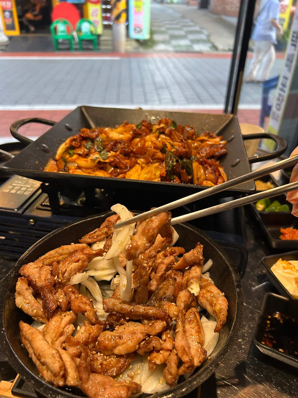 Gopchang and chicken thigh together on the table
