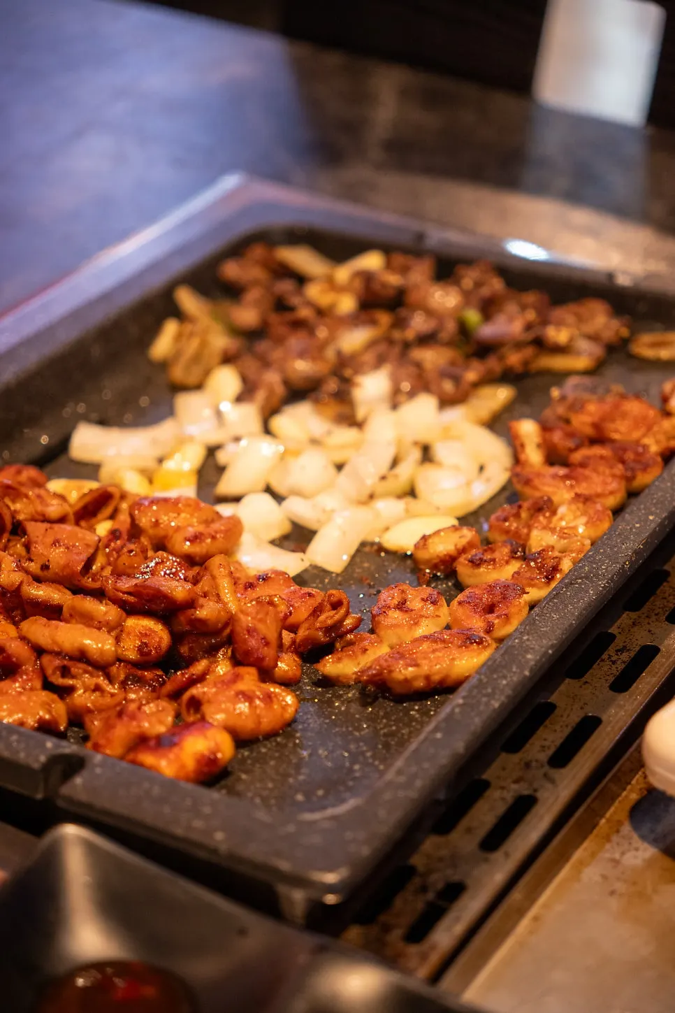 Gopchang dipped in mayo-teriyaki sauce