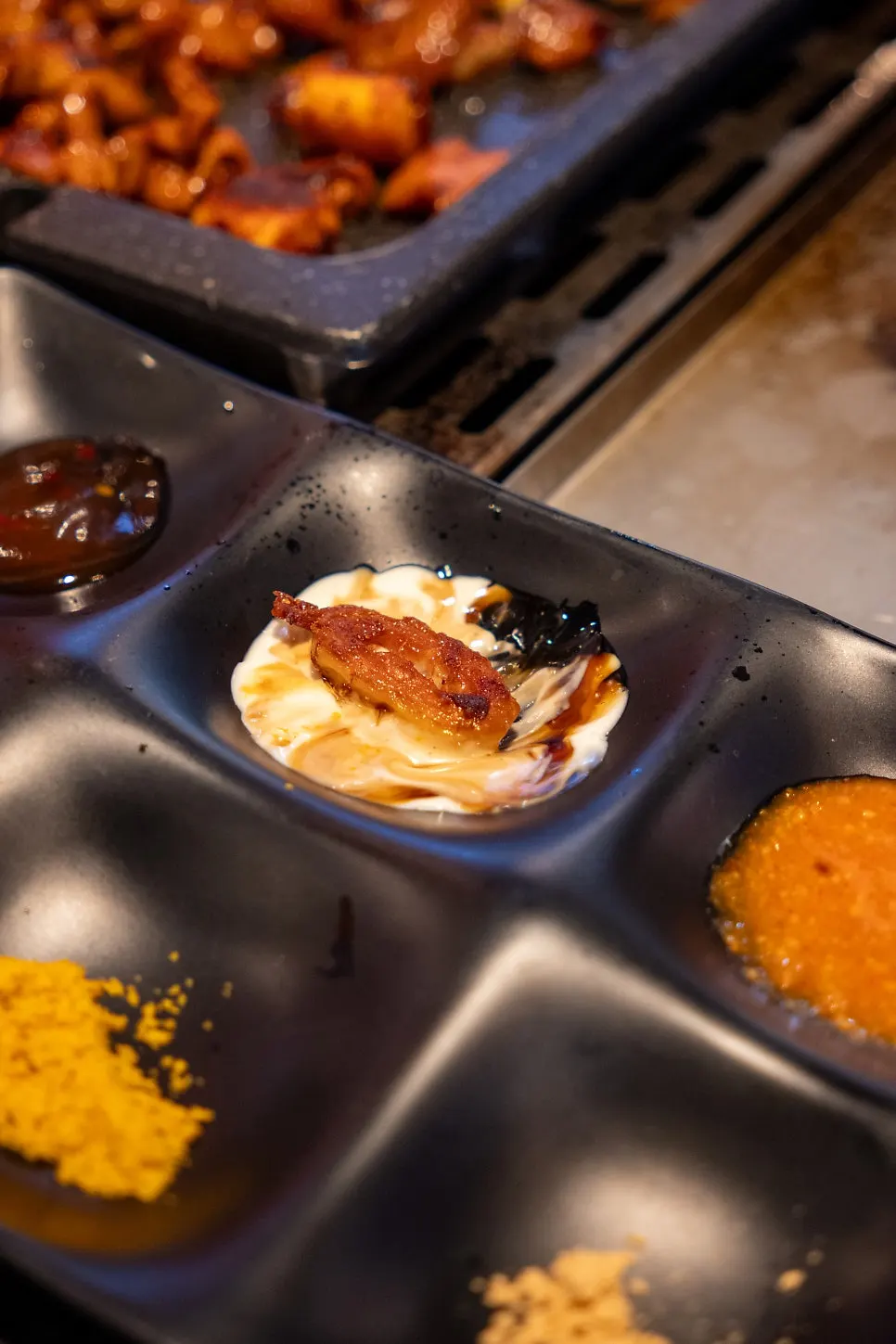A plate combining gopchang with pickled side dishes