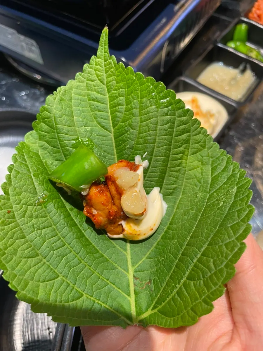 Vegetable gopchang cooking on the griddle