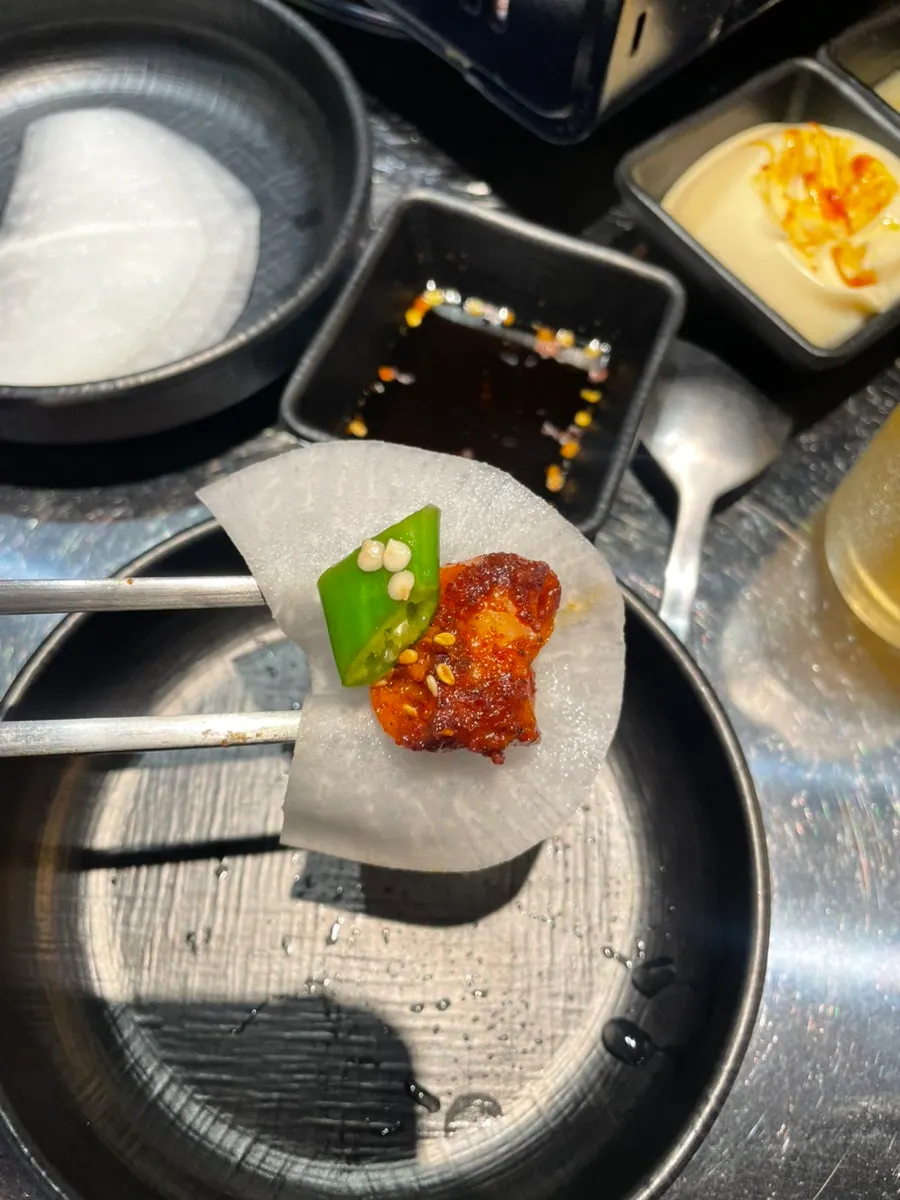 A bite of vegetable gopchang showing a good vegetable-to-meat ratio