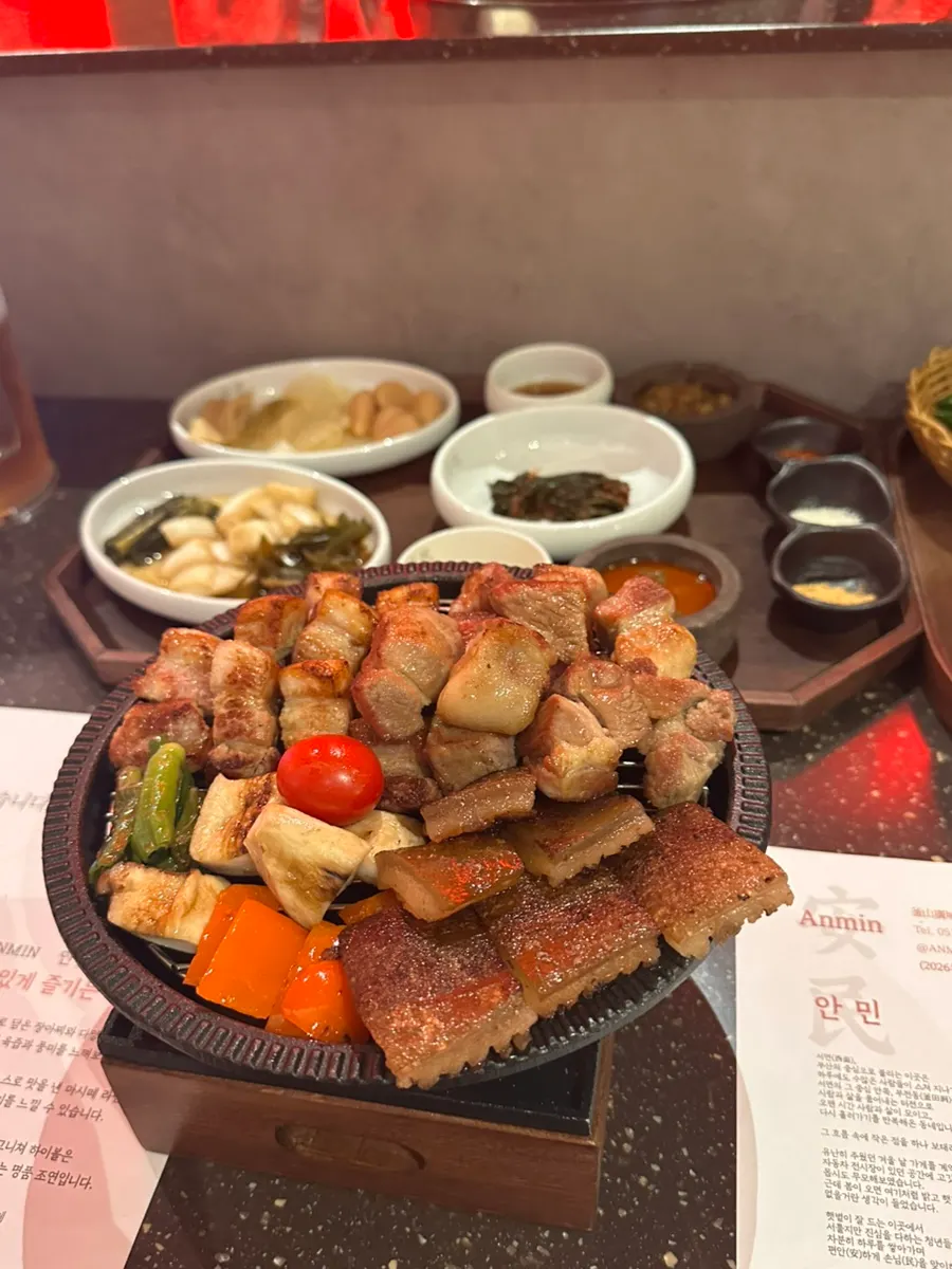 Meat kept warm with a flame lit underneath the plate