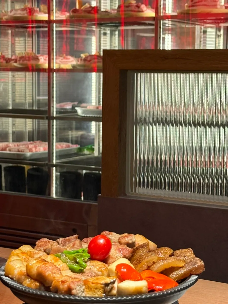Grilled meat plated with garnish