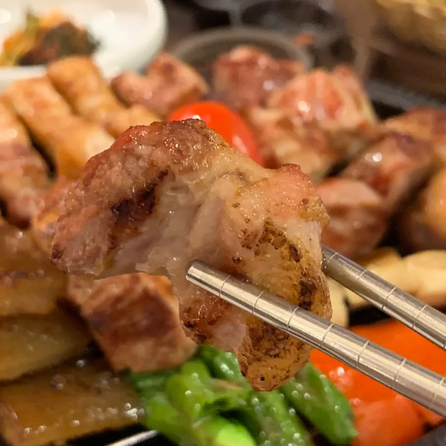 Grilled pork neck cut into bite-sized pieces